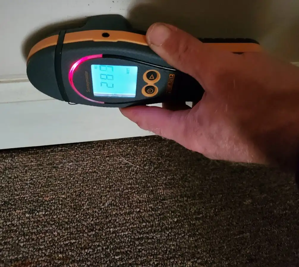 Moisture detection at baseboard during Storm Damage Restoration in La Cresta